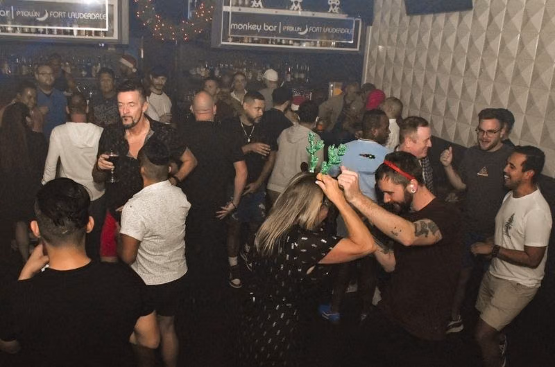 Guests dancing inside Georgie’s Alibi Monkey Bar in Wilton Manors.