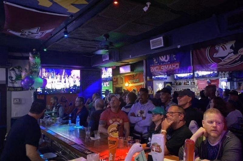 Guests watching television at Gym Sportsbar in Wilton Manors.