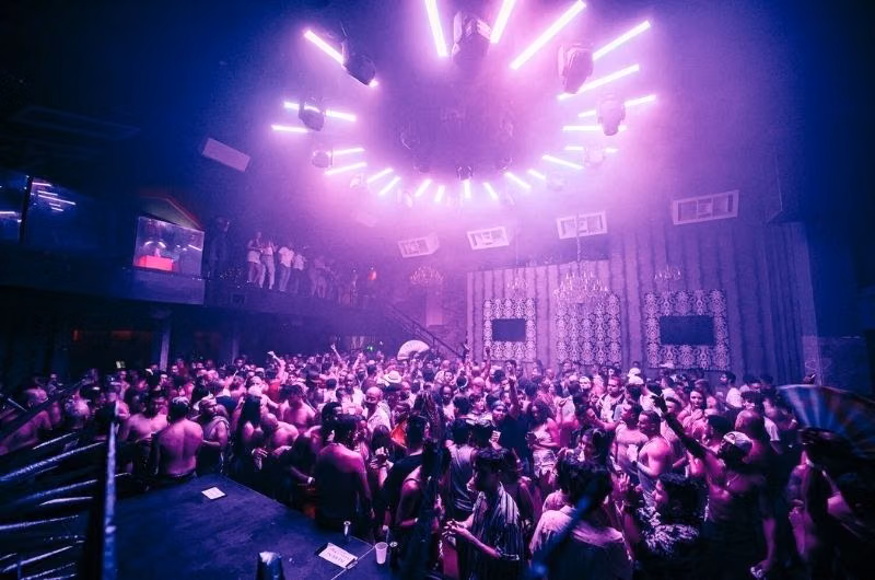 Purple lights above a crowded dance floor at The Manor.