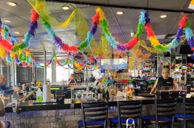Rainbow decorations above the bar at The Pub on the Drive.