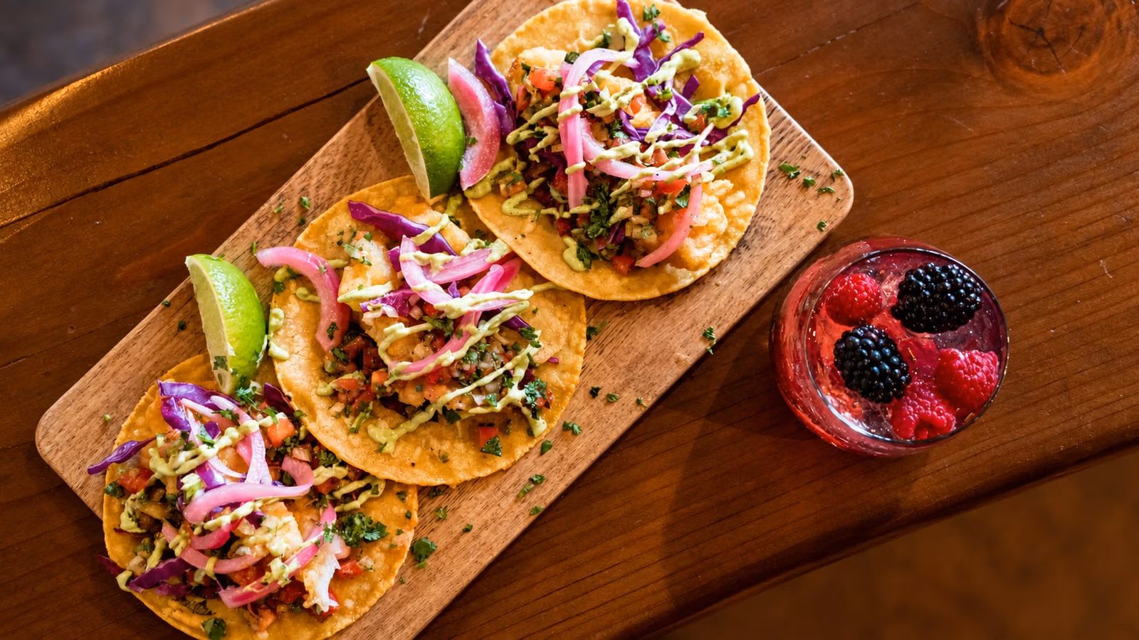 AI recreation of tacos and a berry cocktail at Tulio’s Tacos and Tequila Bar.