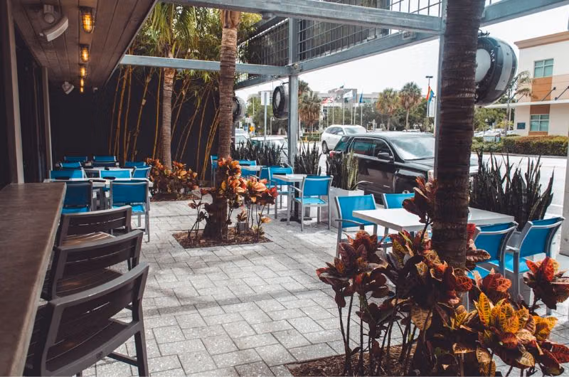 Outdoor tables at ethos Greek Bistro on Wilton Drive
