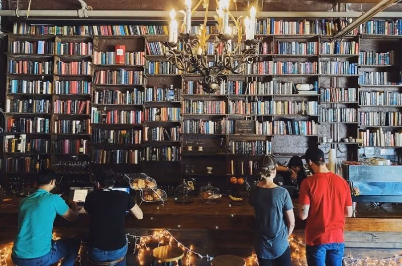 Bookshelves and seating inside Brew Urban Cafe