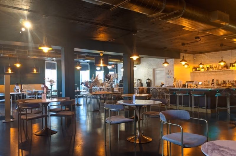 Tables and bar inside Cyth & Co
