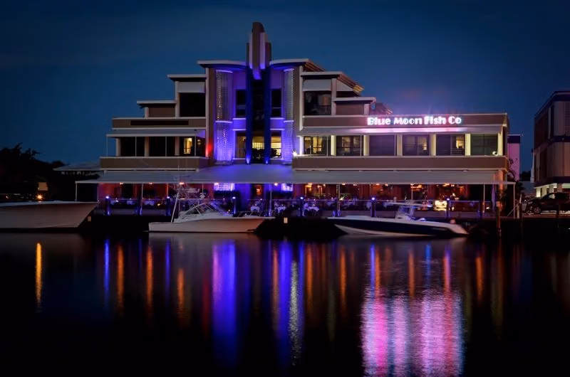 Blue Moon Fish Co. waterfront exterior at night